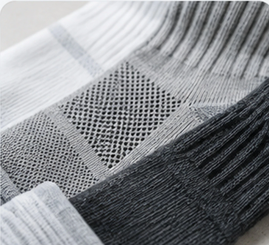 Sock development desk showing design references and construction planning